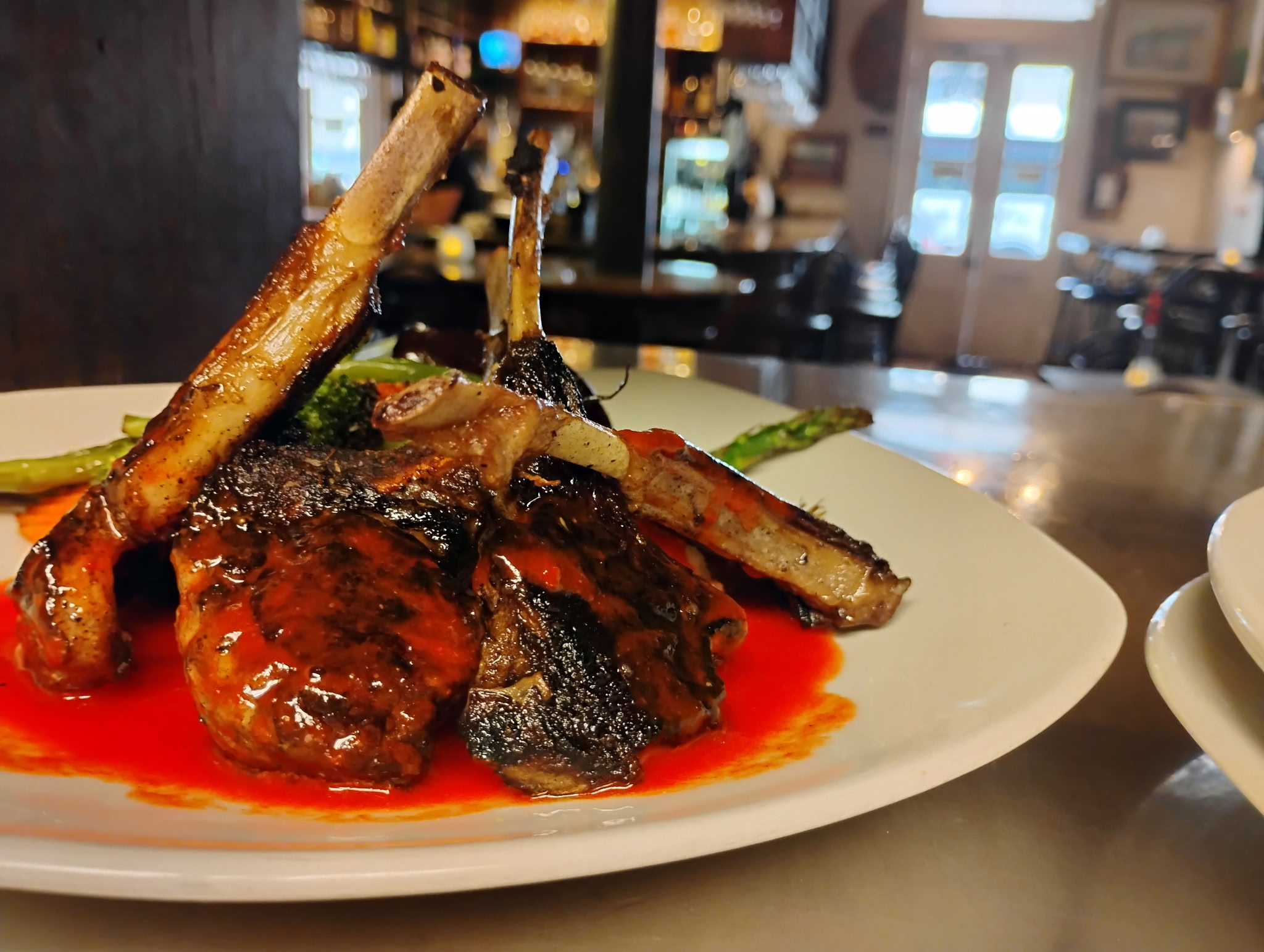 Cocoa dusted, pan seared New Zealand lamb chops, served with truffled mashed potatoes, Chef’s choice of vegetable, and a roasted red pepper coulis. An absolute fan favorite.